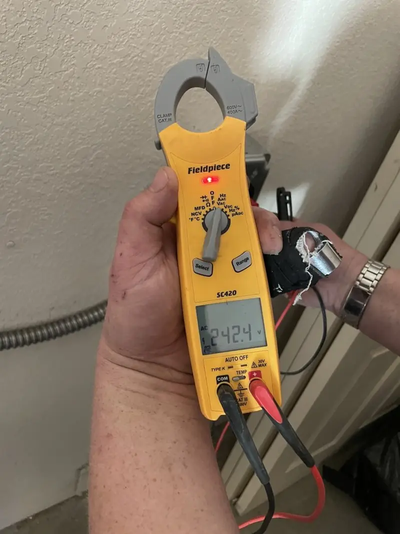 Voltage testing with clamp meter during Hot Tub / Pool Electrical Wiring in Mason